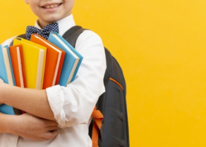 close-up-boy-carrying-stack-books_23-2148470019